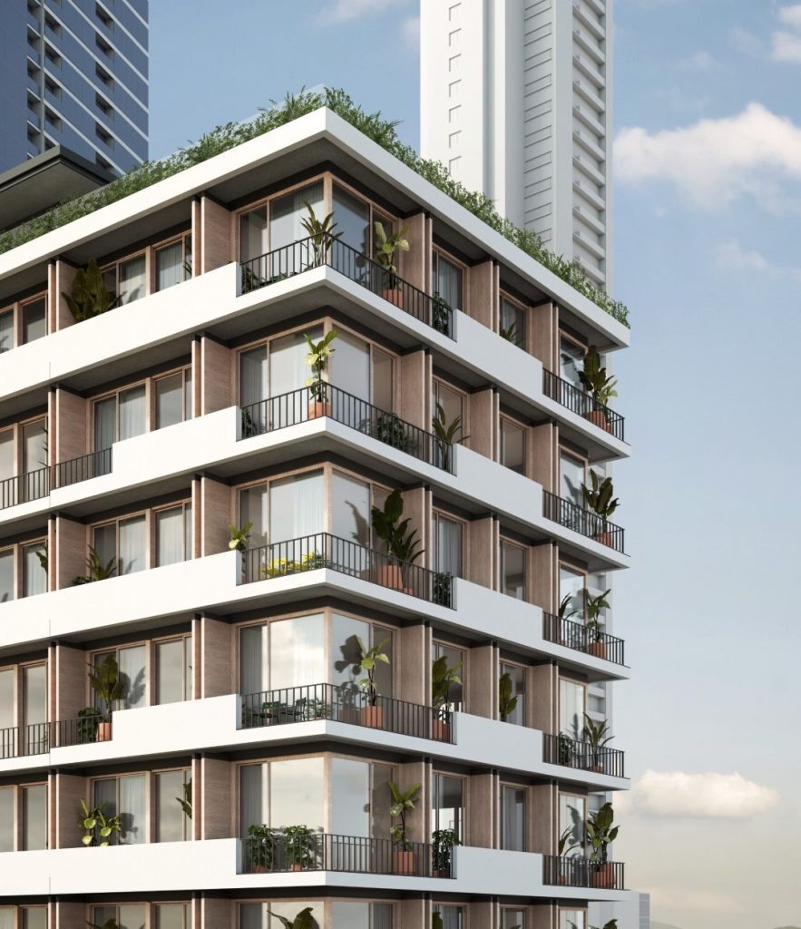 Fachada de edificio residencial con balcones y vegetación, Nook Residence.